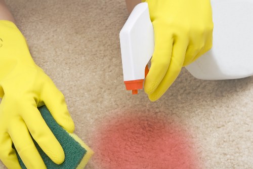 Professional cleaner in Queenspark preparing a spotless living room