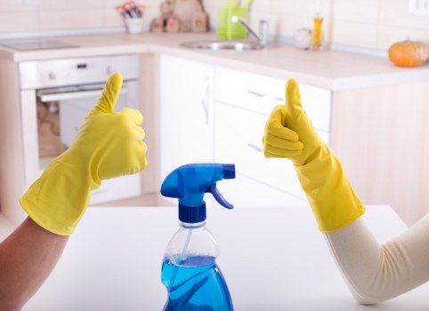 Routine cleaning of bathrooms and kitchen areas in a business property