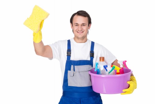 Local turnover cleaner making an Airbnb bed neat and ready in Queenspark